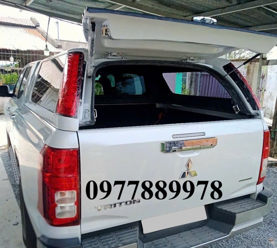 nap-thung-cao-co-den-mitsubishi-triton